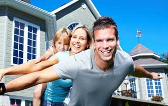 Family in front of house